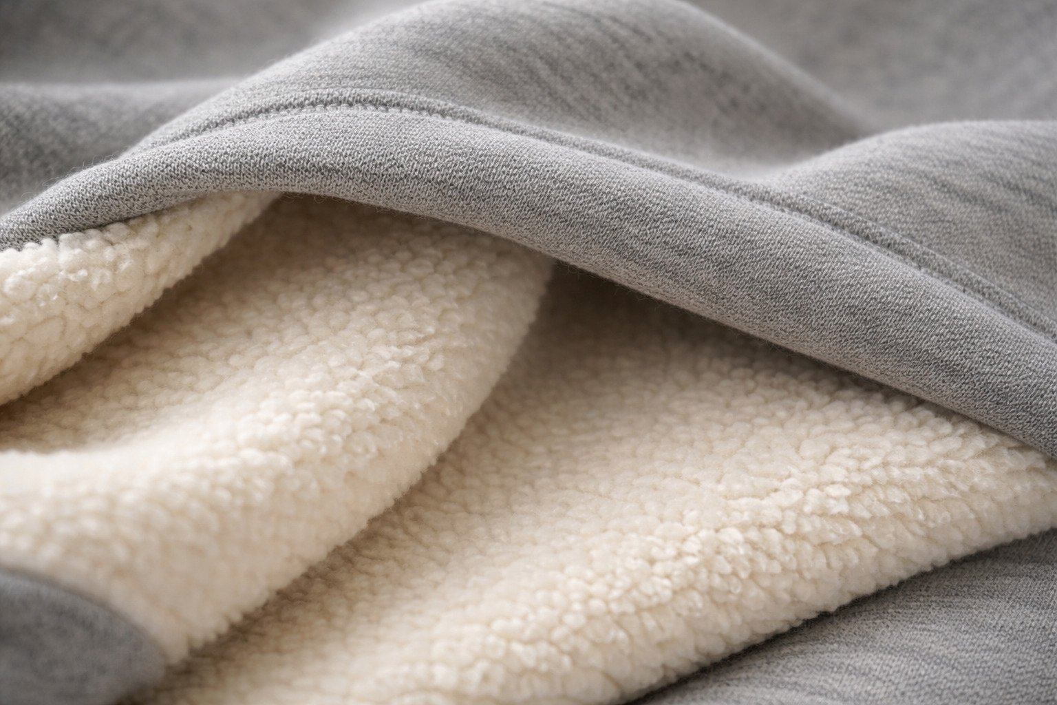 Close-up of hoodie fabric texture showing fleece and cotton blend details